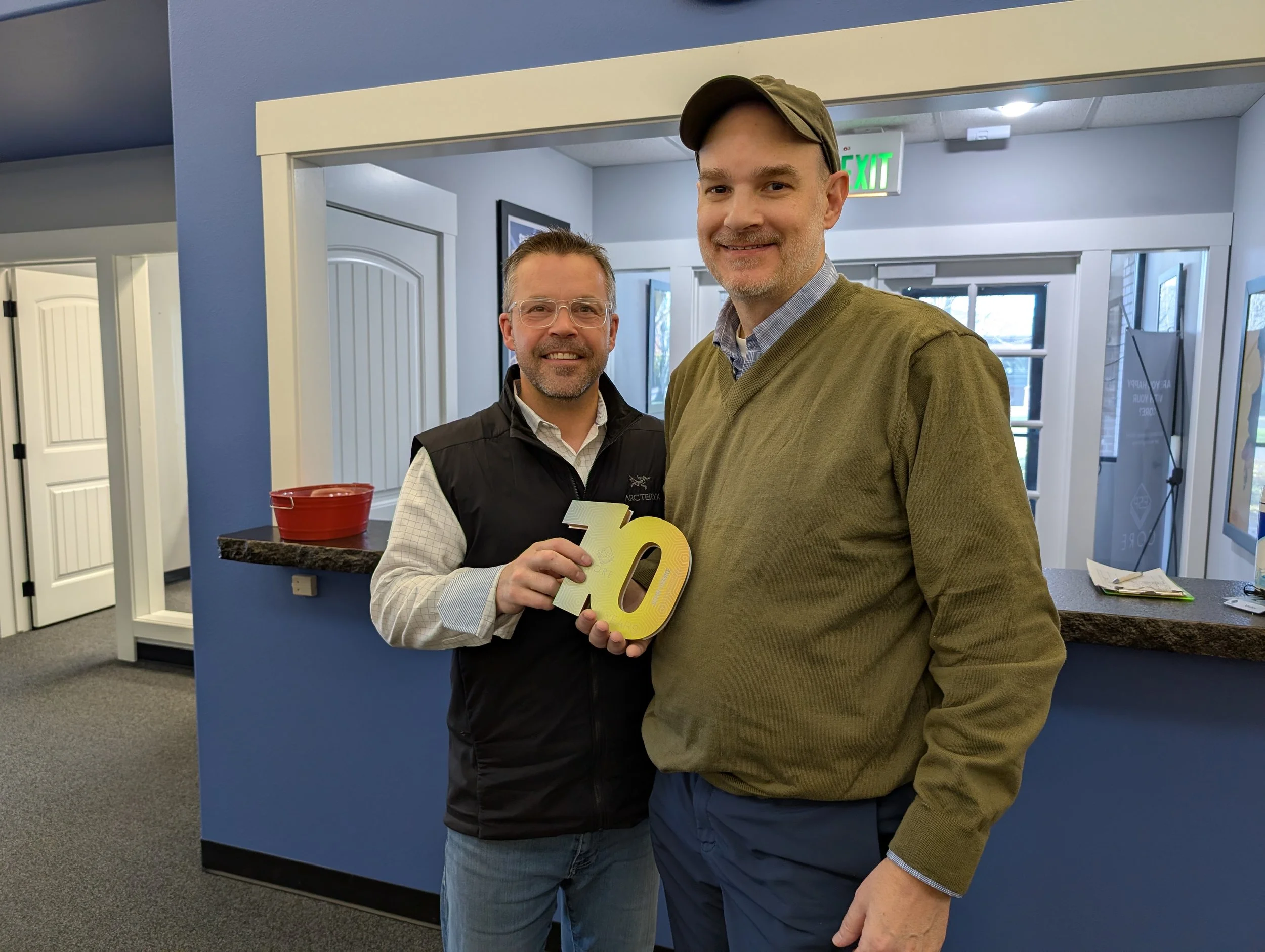 (L to R): Shaun Murray presents John Demke a 10-year anniversary award